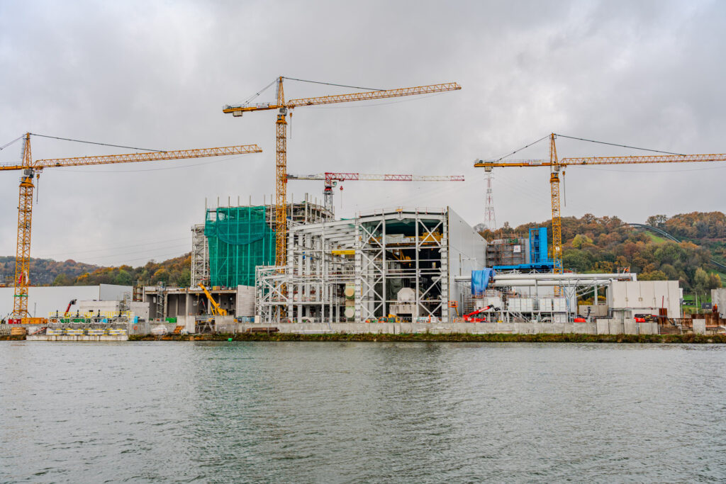 An overview photo of the new awirs power station, 4 cranes can be seen along with the scaffolding of the new installation.