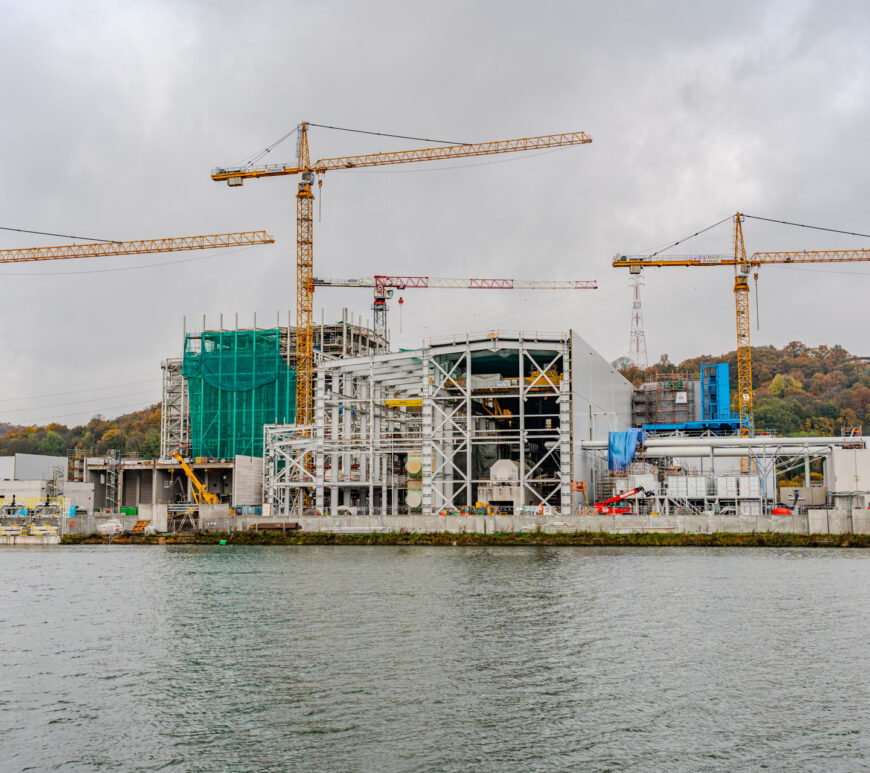 An overview photo of the new awirs power station, 4 cranes can be seen along with the scaffolding of the new installation.