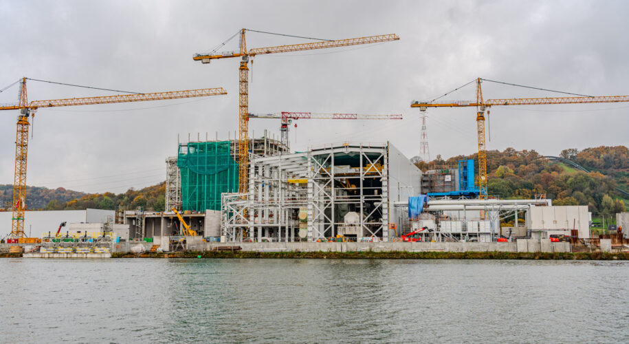 An overview photo of the new awirs power station, 4 cranes can be seen along with the scaffolding of the new installation.